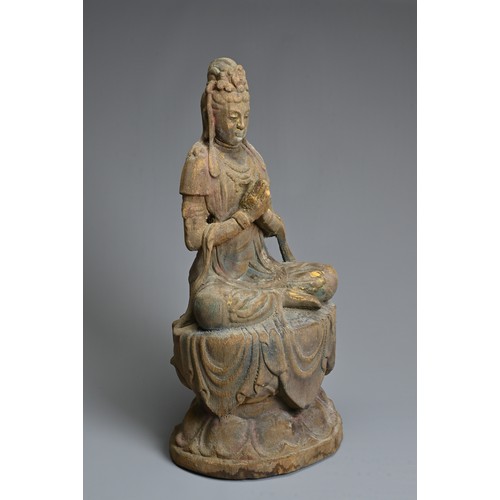 178 - A CHINESE OR SOUTH EAST ASIAN CARVED WOOD, COLD-PAINTED AND GILT FIGURE OF A SEATED BODHISATTVA OR G... 