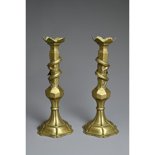 182 - A PAIR OF CHINESE BRONZE CANDLESTICKS, EARLY 20TH CENTURY. Each with dragon coiled around the neck. ... 