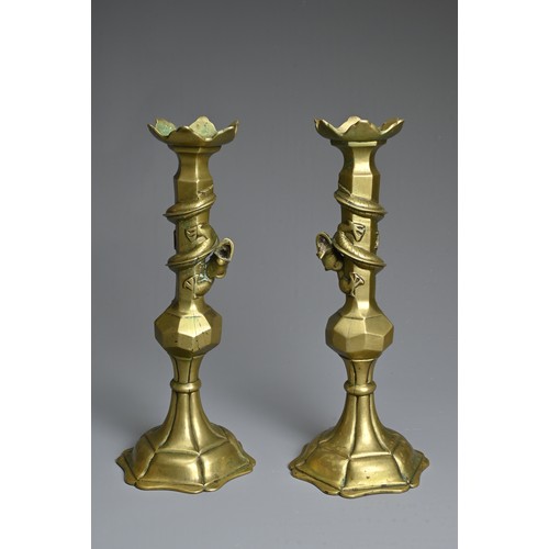 182 - A PAIR OF CHINESE BRONZE CANDLESTICKS, EARLY 20TH CENTURY. Each with dragon coiled around the neck. ... 