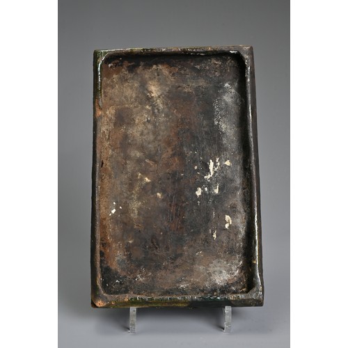 267 - A GREEN-GLAZED POTTERY STOVE TILE, PROBABLY GERMAN AND 16TH CENTURY OR LATER. Moulded with vase issu... 