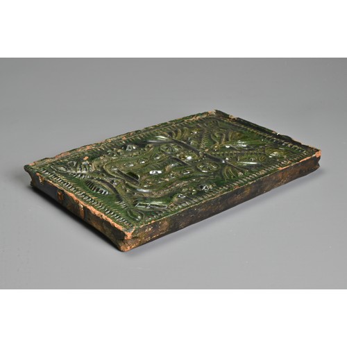 267 - A GREEN-GLAZED POTTERY STOVE TILE, PROBABLY GERMAN AND 16TH CENTURY OR LATER. Moulded with vase issu... 