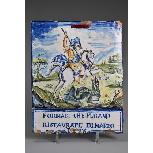 265 - AN ITALIAM MAIOLICA RECTANGULAR PLAQUE IN THE CASTELLI-STYLE. Painted with St George defeating the D... 