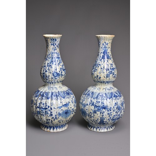 269 - A PAIR OF DUTCH DELFT BLUE AND WHITE FLUTED DOUBLE GOURD-SHAPED BOTTLE VASES AND A HEXAGONAL SECTION... 