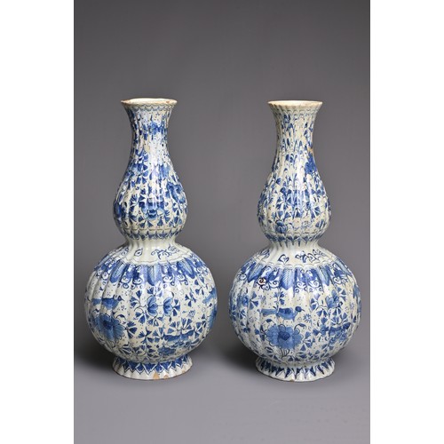 269 - A PAIR OF DUTCH DELFT BLUE AND WHITE FLUTED DOUBLE GOURD-SHAPED BOTTLE VASES AND A HEXAGONAL SECTION... 