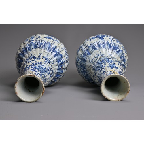 269 - A PAIR OF DUTCH DELFT BLUE AND WHITE FLUTED DOUBLE GOURD-SHAPED BOTTLE VASES AND A HEXAGONAL SECTION... 