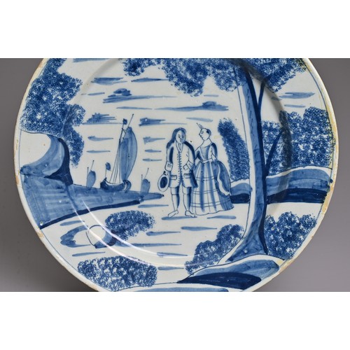 268 - AN ENGLISH DELFTWARE BLUE AND WHITE LARGE PLATE, MID-18TH CENTURY PERHAPS BRISTOL OR LONDON. Painted... 