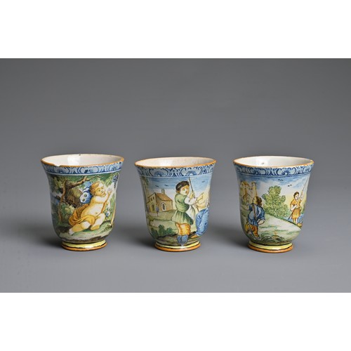 270 - THREE ITALIAN MAIOLICA CASTELLI-STYLE FLARED BEAKERS, 18-19TH CENTURY. Painted with rustic figures a... 