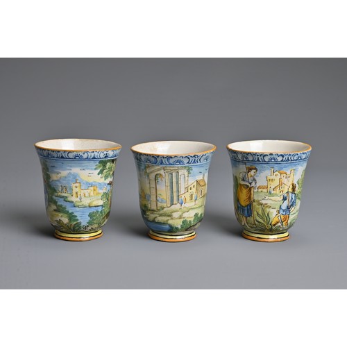 270 - THREE ITALIAN MAIOLICA CASTELLI-STYLE FLARED BEAKERS, 18-19TH CENTURY. Painted with rustic figures a... 