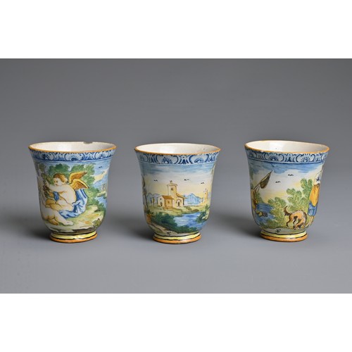 270 - THREE ITALIAN MAIOLICA CASTELLI-STYLE FLARED BEAKERS, 18-19TH CENTURY. Painted with rustic figures a... 