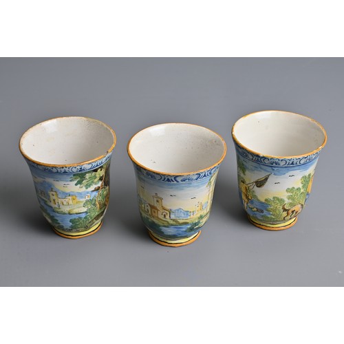 270 - THREE ITALIAN MAIOLICA CASTELLI-STYLE FLARED BEAKERS, 18-19TH CENTURY. Painted with rustic figures a... 