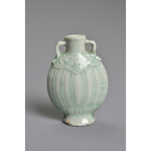 31 - A CHINESE PALE CELADON GLAZED MINIATURE PORCELAIN BOTTLE, 19TH CENTURY. Of flattened ovoid form with... 