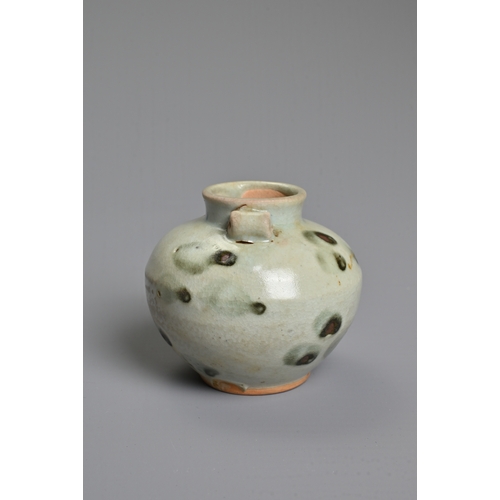 32 - A CHINESE SPOTTED GLAZED PORCELAIN JAR, YUAN DYNASTY. A small globular jar with two looped handles c... 