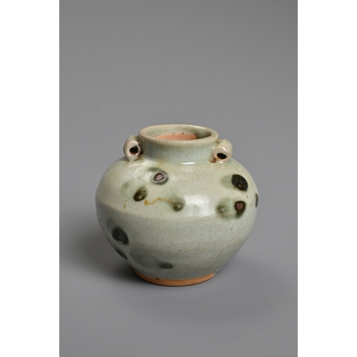 32 - A CHINESE SPOTTED GLAZED PORCELAIN JAR, YUAN DYNASTY. A small globular jar with two looped handles c... 