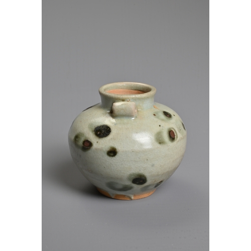 32 - A CHINESE SPOTTED GLAZED PORCELAIN JAR, YUAN DYNASTY. A small globular jar with two looped handles c... 