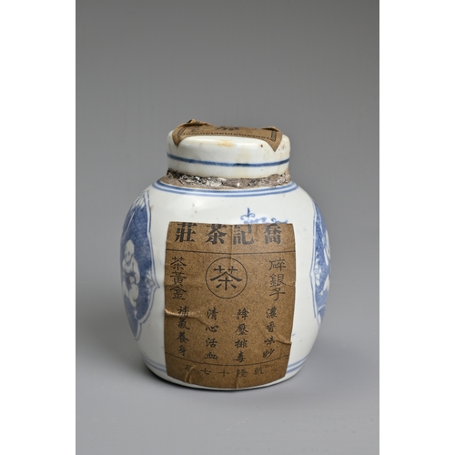 45 - A CHINESE BLUE AND WHITE PORCELAIN JAR AND COVER WITH TEA LABELS. The jar decorated with figures of ... 