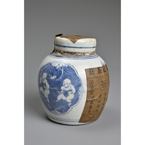 45 - A CHINESE BLUE AND WHITE PORCELAIN JAR AND COVER WITH TEA LABELS. The jar decorated with figures of ... 