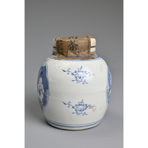 45 - A CHINESE BLUE AND WHITE PORCELAIN JAR AND COVER WITH TEA LABELS. The jar decorated with figures of ... 