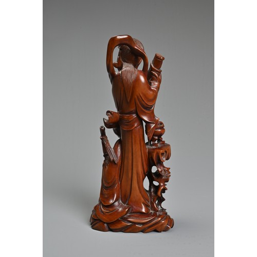 29 - A CHINESE CARVED BOXWOOD FIGURE OF GUANYIN. Well carved depicting figure of Guanyin next to a girl s... 