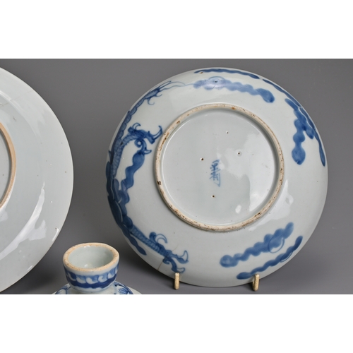 69 - THREE CHINESE BLUE AND WHITE PORCELAIN ITEMS, 18/19TH CENTURY. To include a dragon dish with charact... 