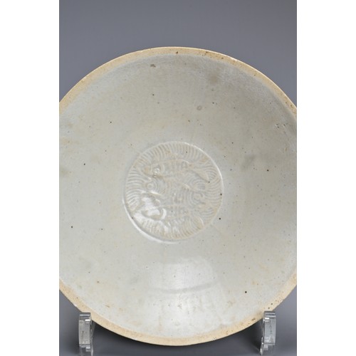 170 - A CHINESE LONGQUAN BOWL, SONG DYNASTY. Of flared form, with everted rim in pale greyish glaze, the c... 