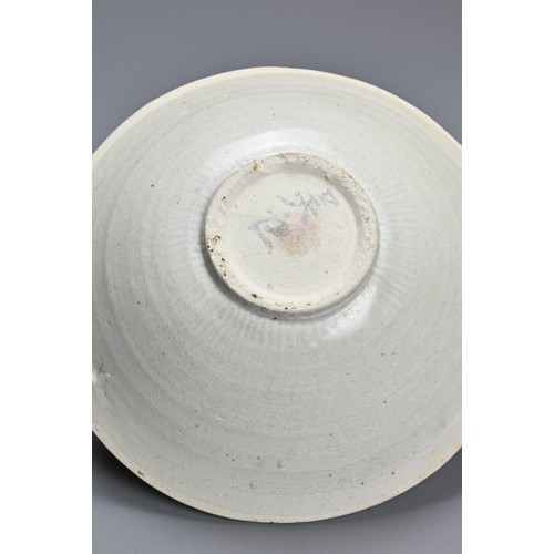 170 - A CHINESE LONGQUAN BOWL, SONG DYNASTY. Of flared form, with everted rim in pale greyish glaze, the c... 