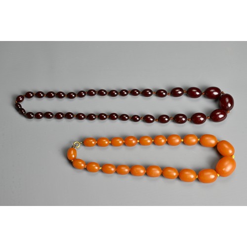 276 - AMBER BEADED NECKLACE, Oval beads of graduating sizes on a metal clasp, total weight 56 grams, appro... 