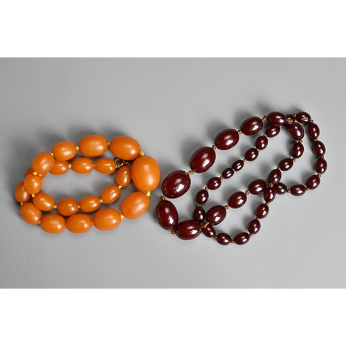 276 - AMBER BEADED NECKLACE, Oval beads of graduating sizes on a metal clasp, total weight 56 grams, appro... 