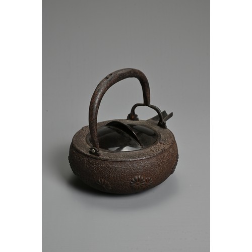 237 - A 20TH CENTURY JAPANESE CAST IRON CHOSHI (SAKE EWER), of squat form on tripod feet with black lacque... 