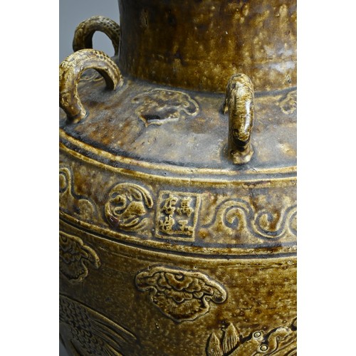 169 - A LARGE CHINESE OR SOUTHEAST ASIAN BROWN GLAZED MARTABAN STORAGE JAR, 17/18TH CENTURY. Moulded with ... 