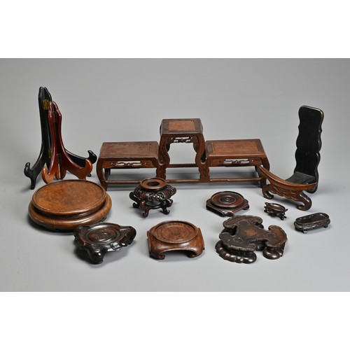 219 - A GROUP OF ASSORTED PLATE AND VASES STANDS, including carved hardwood CHINESE and Japanese examples,... 