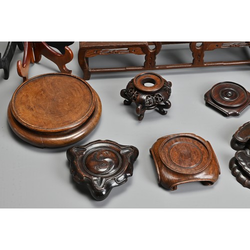 219 - A GROUP OF ASSORTED PLATE AND VASES STANDS, including carved hardwood CHINESE and Japanese examples,... 