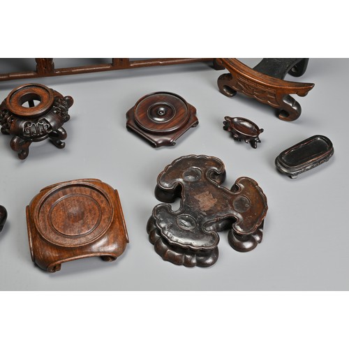 219 - A GROUP OF ASSORTED PLATE AND VASES STANDS, including carved hardwood CHINESE and Japanese examples,... 