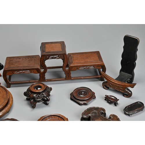 219 - A GROUP OF ASSORTED PLATE AND VASES STANDS, including carved hardwood CHINESE and Japanese examples,... 