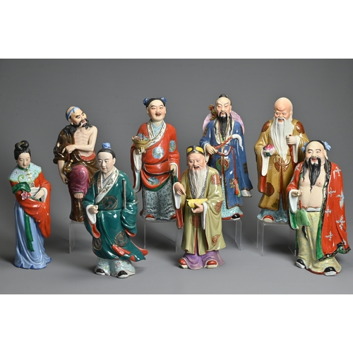 223 - A GROUP OF EIGHT CHINESE POLYCHROME DECORATED PORCELAIN FIGURES, 20TH CENTURY. To include seven figu... 