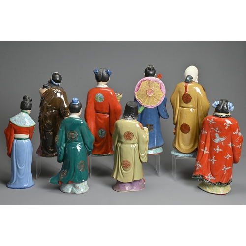 223 - A GROUP OF EIGHT CHINESE POLYCHROME DECORATED PORCELAIN FIGURES, 20TH CENTURY. To include seven figu... 