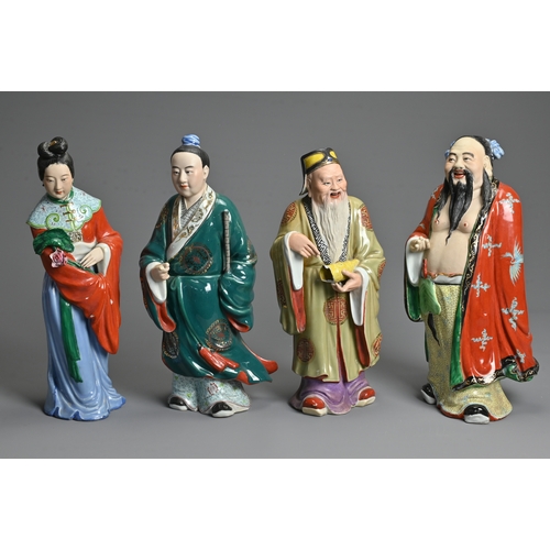 223 - A GROUP OF EIGHT CHINESE POLYCHROME DECORATED PORCELAIN FIGURES, 20TH CENTURY. To include seven figu... 