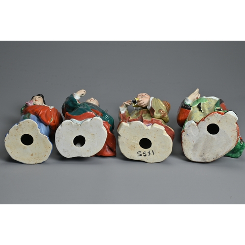 223 - A GROUP OF EIGHT CHINESE POLYCHROME DECORATED PORCELAIN FIGURES, 20TH CENTURY. To include seven figu... 