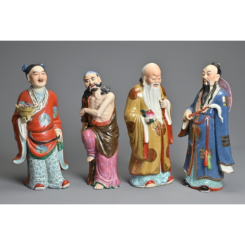 223 - A GROUP OF EIGHT CHINESE POLYCHROME DECORATED PORCELAIN FIGURES, 20TH CENTURY. To include seven figu... 