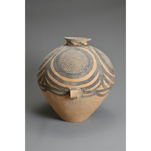 111 - A LARGE CHINESE NEOLITHIC MACHANG PAINTED POTTERY JAR. With two wide lug handles at the waist decora... 