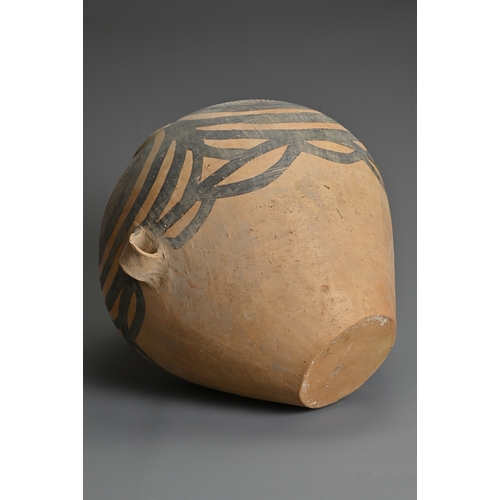 111 - A LARGE CHINESE NEOLITHIC MACHANG PAINTED POTTERY JAR. With two wide lug handles at the waist decora... 