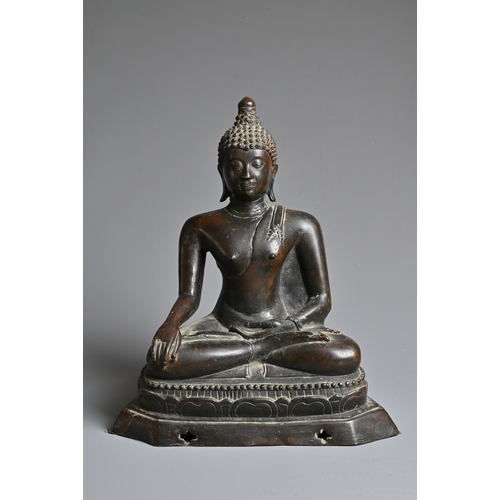 228 - A THAI BRONZE FIGURE OF BUDDHA SHAKYAMUNI, 18/19TH CENTURY. Well cast, dressed in robe seated on a s... 