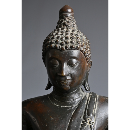 228 - A THAI BRONZE FIGURE OF BUDDHA SHAKYAMUNI, 18/19TH CENTURY. Well cast, dressed in robe seated on a s... 