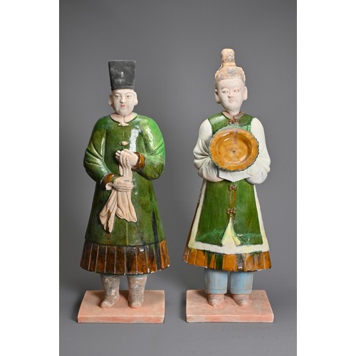 114 - A VERY LARGE PAIR OF CHINESE SANCAI GLAZED POTTERY FIGURES, MING DYNASTY OR LATER. Each figure heavi... 