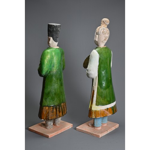 114 - A VERY LARGE PAIR OF CHINESE SANCAI GLAZED POTTERY FIGURES, MING DYNASTY OR LATER. Each figure heavi... 