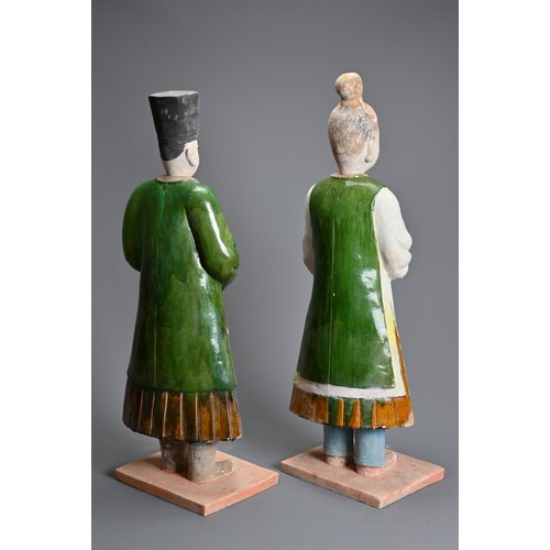 114 - A VERY LARGE PAIR OF CHINESE SANCAI GLAZED POTTERY FIGURES, MING DYNASTY OR LATER. Each figure heavi... 