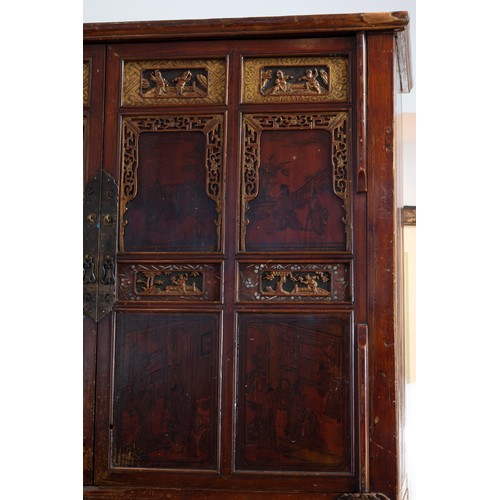 213 - CHINESE RED LACQUER CABINET, 19/20TH CENTURY. With a planked top above twin doors with two shelves a... 