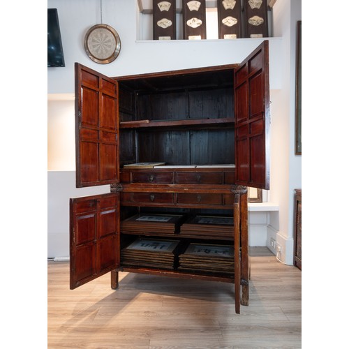 213 - CHINESE RED LACQUER CABINET, 19/20TH CENTURY. With a planked top above twin doors with two shelves a... 