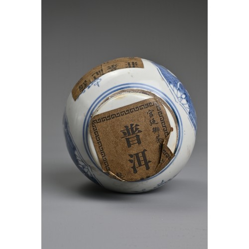 45 - A CHINESE BLUE AND WHITE PORCELAIN JAR AND COVER WITH TEA LABELS. The jar decorated with figures of ... 