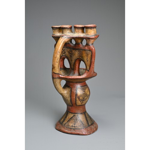 230 - A PAINTED BERBER OIL LAMP, KABYLIA ALGERIA, EARLY 20TH CENTURY. Low fired ceramic oil lamp modelled ... 