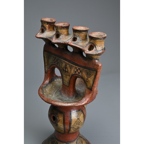 230 - A PAINTED BERBER OIL LAMP, KABYLIA ALGERIA, EARLY 20TH CENTURY. Low fired ceramic oil lamp modelled ... 